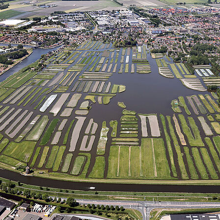Luchtfoto landschapsreservaat Oosterdel naast het Stationsgebied